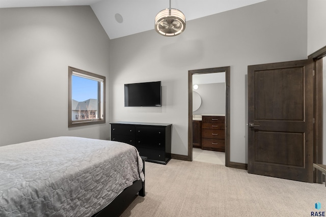 912 Torrey Pine Ln, Sioux Falls, SD 57110 - bedroom featuring ensuite bathroom, baseboards, high vaulted ceiling, and light colored carpet
