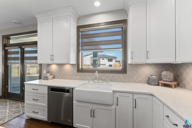 912 Torrey Pine Ln, Sioux Falls, SD 57110 - kitchen with white cabinets, stainless steel dishwasher, a sink, and tasteful backsplash