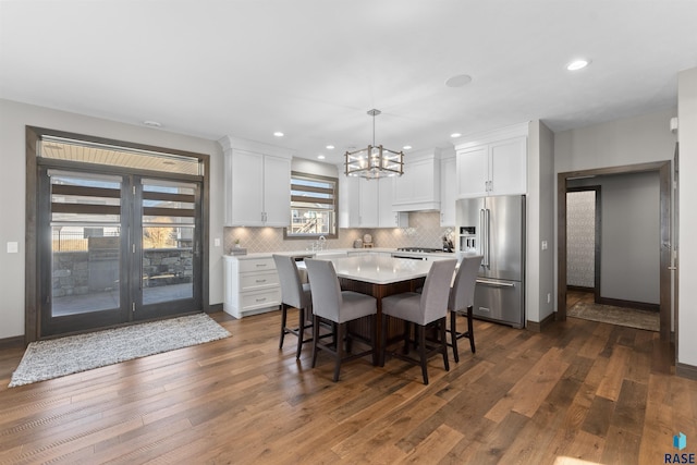 912 Torrey Pine Ln, Sioux Falls, SD 57110 - dining room with baseboards, a notable chandelier, dark wood-style floors, and recessed lighting
