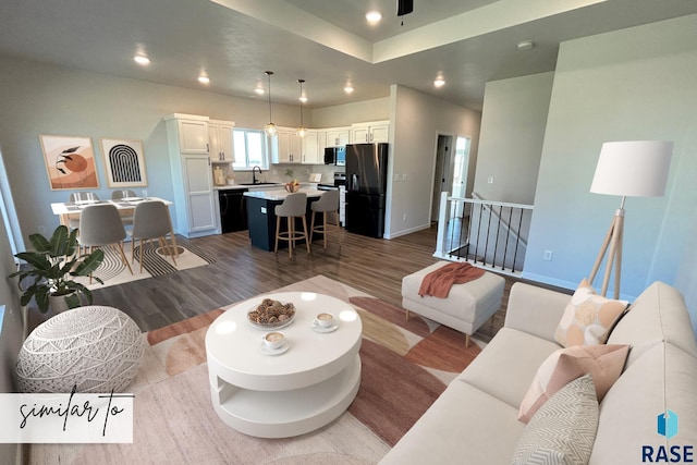 5301 E Lumin St, Sioux Falls, SD 57108 - living room featuring a ceiling fan, baseboards, recessed lighting, and dark wood-style flooring