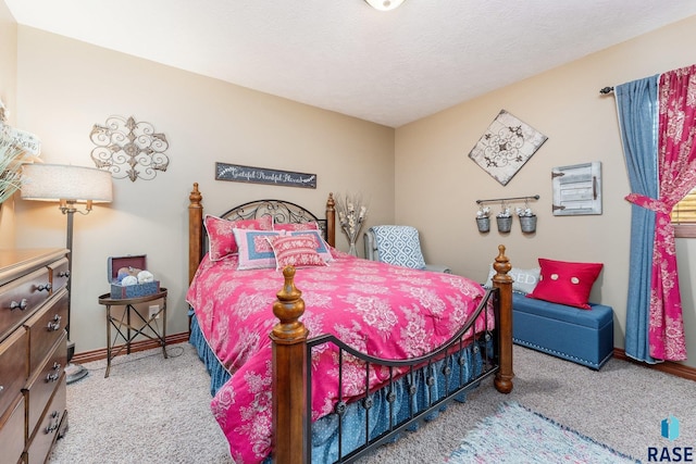 bedroom with carpet flooring and baseboards