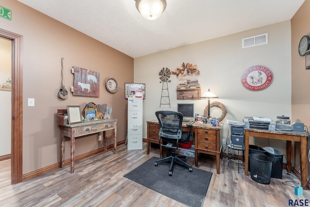 office featuring baseboards, wood finished floors, and visible vents