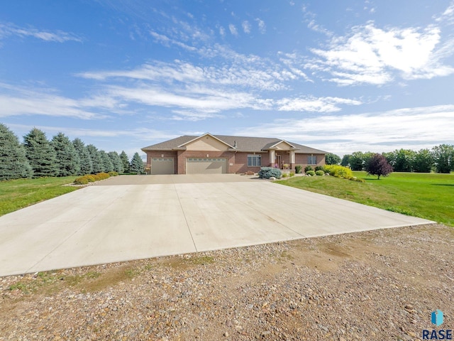 ranch-style house featuring brick siding, a front lawn, and driveway