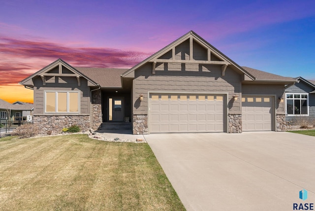 3508 E Prairie Wind St, Sioux Falls, SD 57108 - craftsman-style home featuring an attached garage, stone siding, concrete driveway, and a lawn