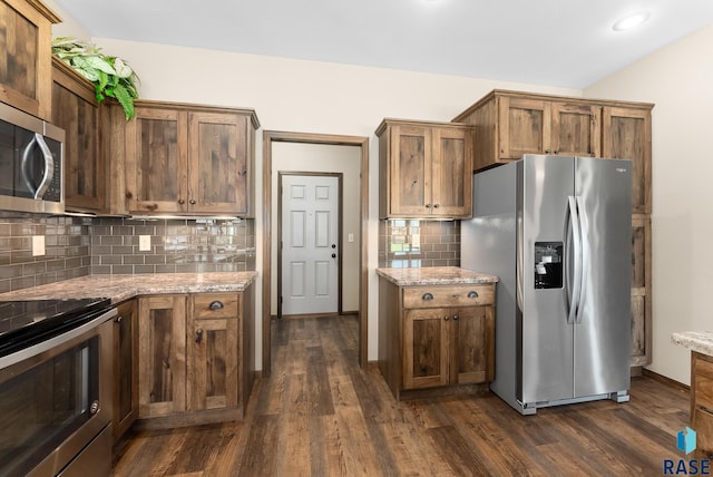 3508 E Prairie Wind St, Sioux Falls, SD 57108 - kitchen featuring light stone countertops, tasteful backsplash, appliances with stainless steel finishes, and dark wood-style flooring