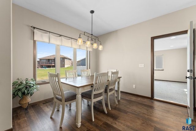 3508 E Prairie Wind St, Sioux Falls, SD 57108 - dining space with wood finished floors, visible vents, and baseboards