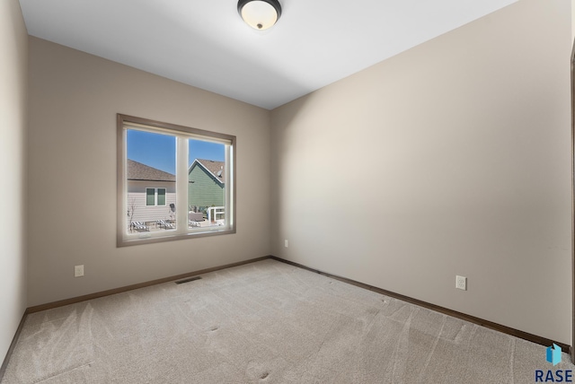 3508 E Prairie Wind St, Sioux Falls, SD 57108 - empty room featuring light colored carpet, baseboards, and visible vents
