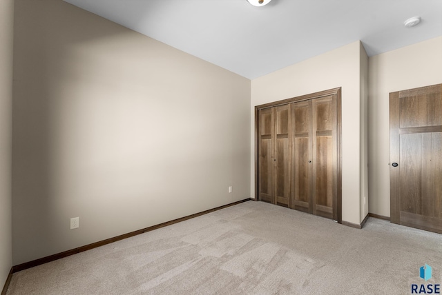 3508 E Prairie Wind St, Sioux Falls, SD 57108 - unfurnished bedroom featuring baseboards, a closet, and light colored carpet
