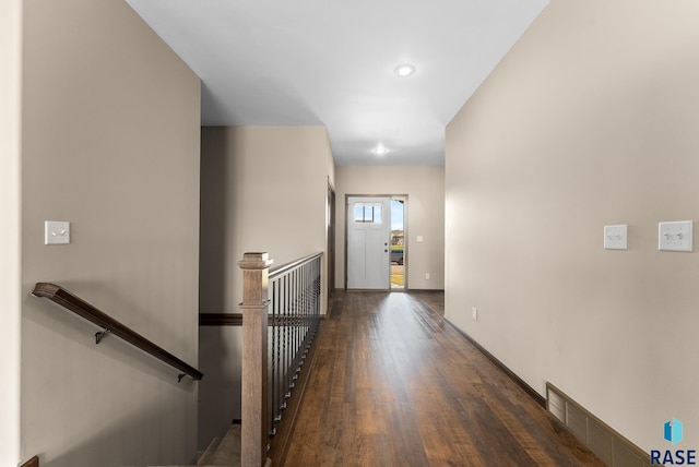 3508 E Prairie Wind St, Sioux Falls, SD 57108 - corridor with recessed lighting, wood finished floors, visible vents, an upstairs landing, and baseboards