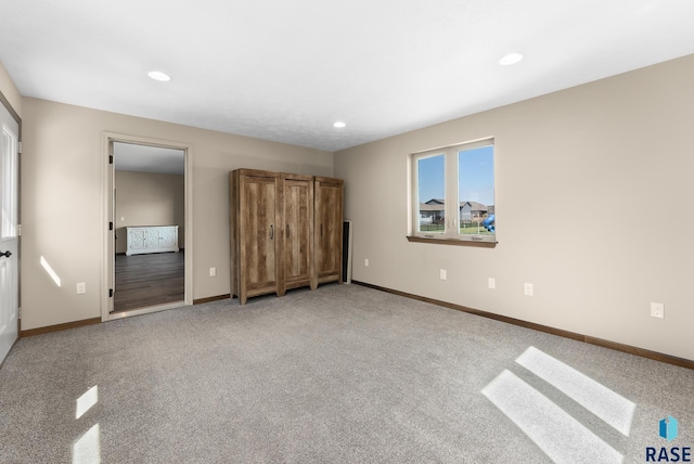 3508 E Prairie Wind St, Sioux Falls, SD 57108 - unfurnished bedroom with light colored carpet, baseboards, and recessed lighting
