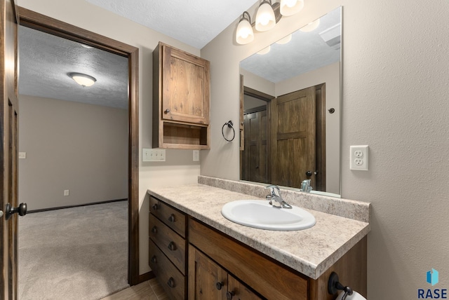 3508 E Prairie Wind St, Sioux Falls, SD 57108 - bathroom featuring vanity and a textured ceiling