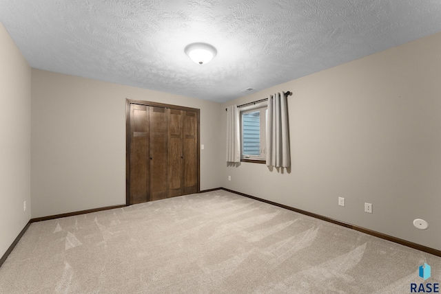 3508 E Prairie Wind St, Sioux Falls, SD 57108 - unfurnished bedroom featuring baseboards, a closet, and carpet flooring