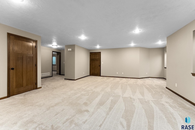 3508 E Prairie Wind St, Sioux Falls, SD 57108 - finished below grade area featuring visible vents, baseboards, and light colored carpet