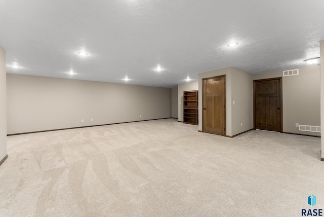 3508 E Prairie Wind St, Sioux Falls, SD 57108 - finished basement featuring baseboards, visible vents, and light colored carpet