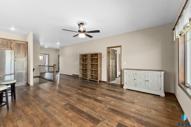 3508 E Prairie Wind St, Sioux Falls, SD 57108 - living area featuring baseboards, a ceiling fan, visible vents, and dark wood finished floors