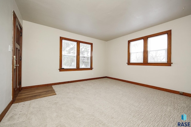 1330 W 14th St, Sioux Falls, SD 57104 - empty room featuring baseboards and carpet