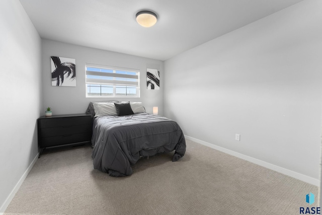 carpeted bedroom with baseboards