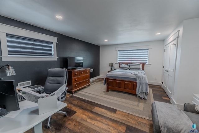 bedroom with recessed lighting, wood finished floors, and visible vents