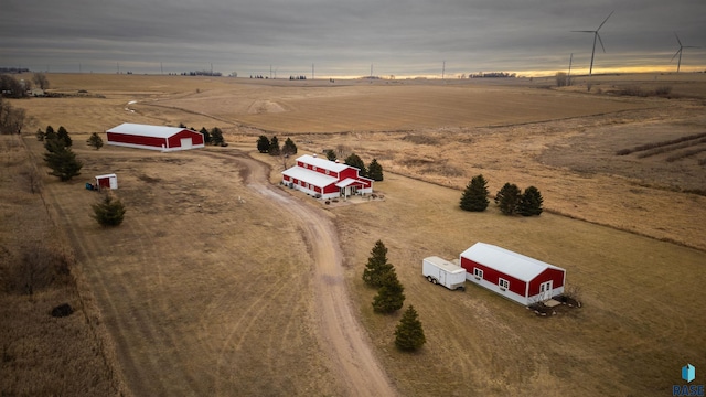 birds eye view of property with a rural view