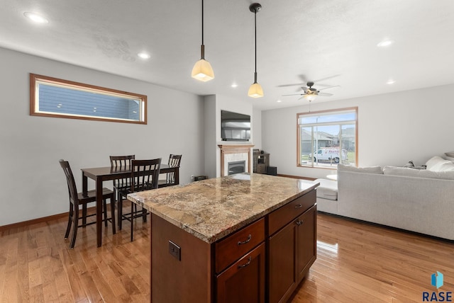 5508 S Sirocco Ave, Sioux Falls, SD 57108 - kitchen with a center island, open floor plan, light wood-style flooring, and recessed lighting