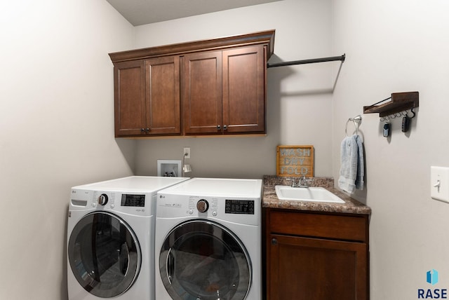 5508 S Sirocco Ave, Sioux Falls, SD 57108 - washroom featuring cabinet space, washer and clothes dryer, and a sink
