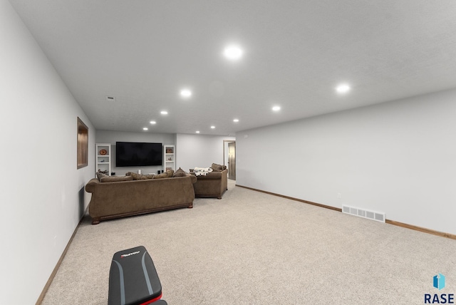 5508 S Sirocco Ave, Sioux Falls, SD 57108 - living room with light carpet, baseboards, visible vents, and recessed lighting