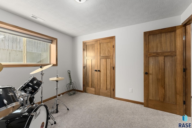5508 S Sirocco Ave, Sioux Falls, SD 57108 - interior space featuring baseboards, visible vents, a textured ceiling, and carpet flooring
