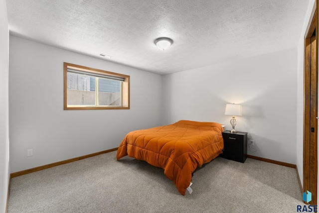 5508 S Sirocco Ave, Sioux Falls, SD 57108 - bedroom with carpet floors, a textured ceiling, visible vents, and baseboards