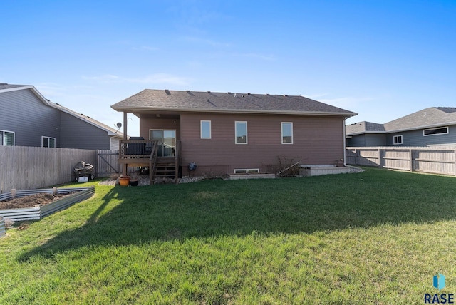 5508 S Sirocco Ave, Sioux Falls, SD 57108 - back of property featuring a yard, a vegetable garden, and a fenced backyard