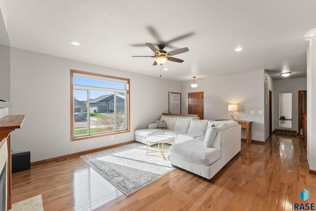 5508 S Sirocco Ave, Sioux Falls, SD 57108 - living area with ceiling fan, baseboards, visible vents, and light wood-type flooring