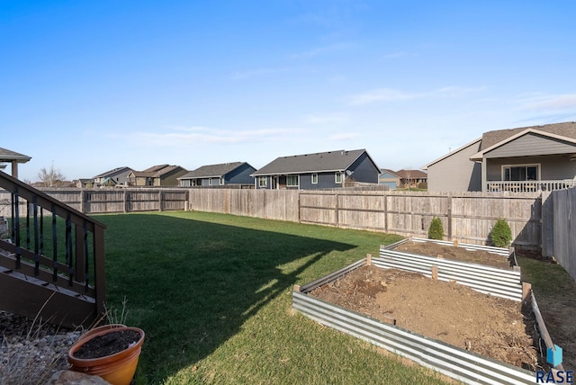 5508 S Sirocco Ave, Sioux Falls, SD 57108 - view of yard featuring a fenced backyard, a vegetable garden, and a residential view