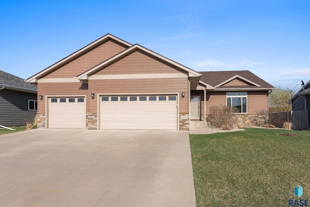 5508 S Sirocco Ave, Sioux Falls, SD 57108 - craftsman inspired home featuring stone siding, an attached garage, a front lawn, and driveway