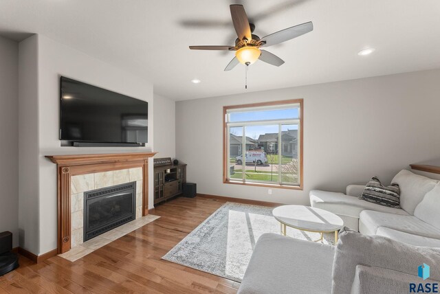 5508 S Sirocco Ave, Sioux Falls, SD 57108 - living room with ceiling fan, baseboards, wood finished floors, and recessed lighting