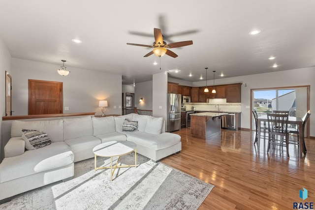 5508 S Sirocco Ave, Sioux Falls, SD 57108 - living area featuring recessed lighting, wood finished floors, and a ceiling fan