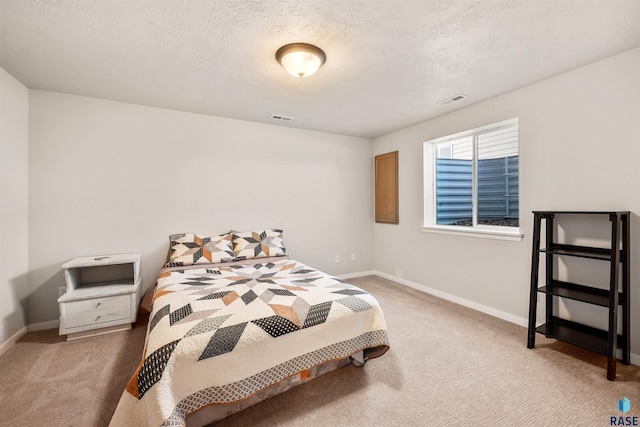812 Sarah C Cir, Garretson, SD 57030 - carpeted bedroom with a textured ceiling, visible vents, and baseboards