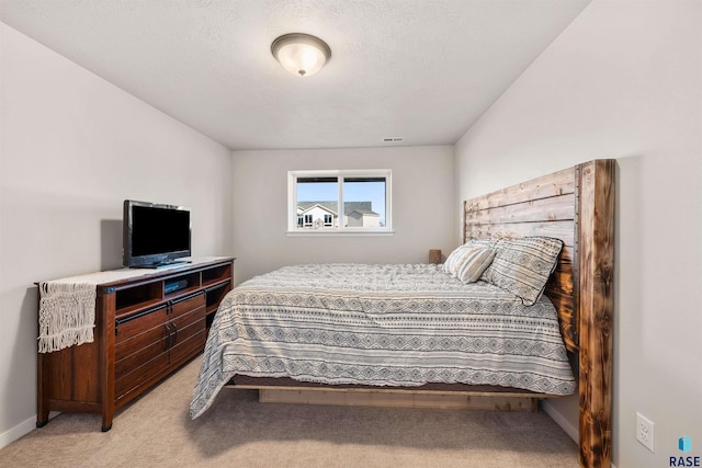 812 Sarah C Cir, Garretson, SD 57030 - bedroom featuring visible vents, baseboards, and light colored carpet
