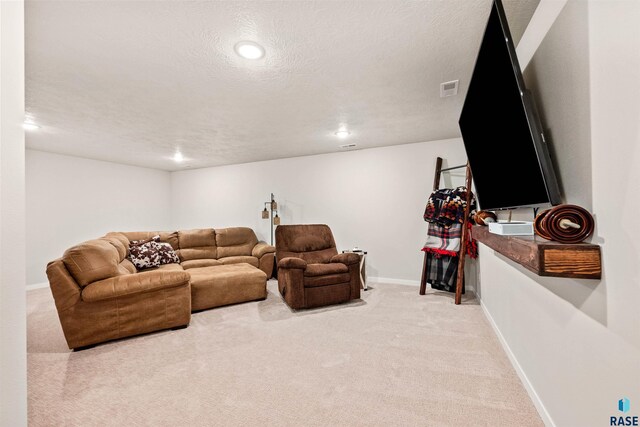 812 Sarah C Cir, Garretson, SD 57030 - carpeted living area featuring baseboards, visible vents, recessed lighting, and a textured ceiling
