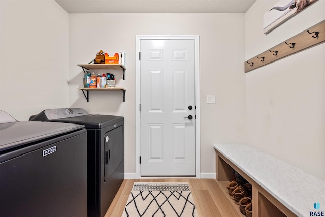 812 Sarah C Cir, Garretson, SD 57030 - washroom featuring light wood finished floors, baseboards, washer and clothes dryer, and laundry area