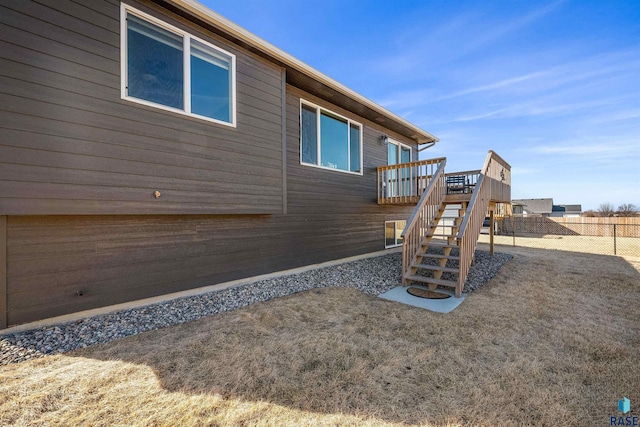 812 Sarah C Cir, Garretson, SD 57030 - view of side of home with stairway, fence, and a deck