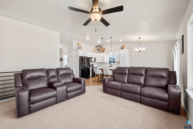 812 Sarah C Cir, Garretson, SD 57030 - living room featuring light carpet and ceiling fan with notable chandelier