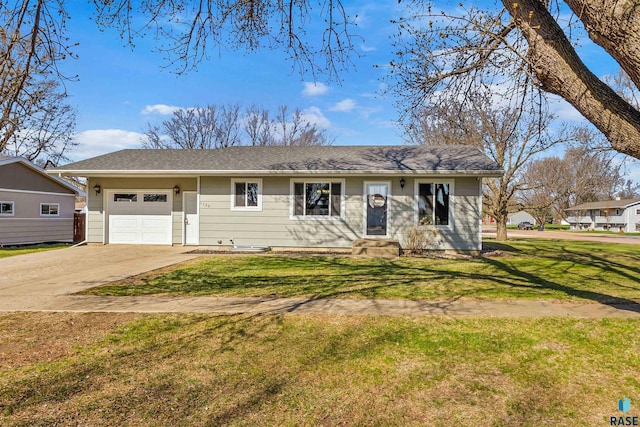 single story home with an attached garage, driveway, entry steps, and a front yard