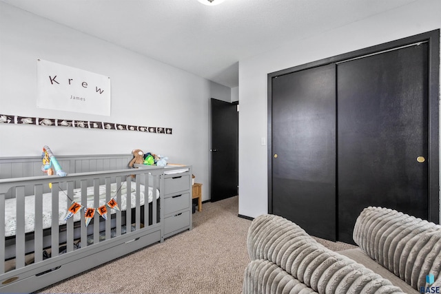 bedroom with carpet floors and a closet