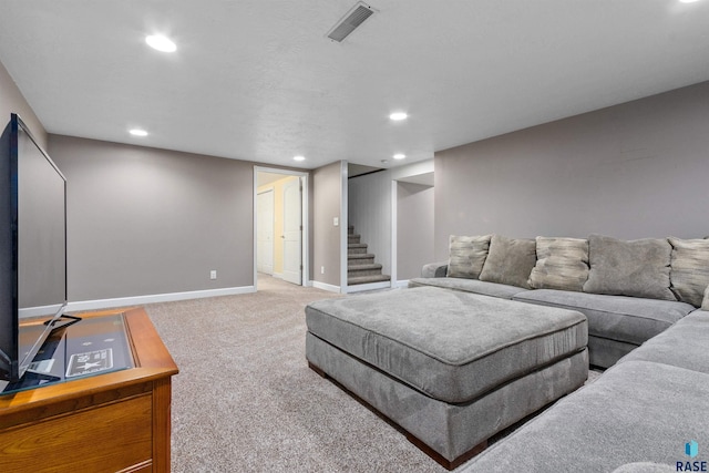 living area with recessed lighting, visible vents, light colored carpet, baseboards, and stairs