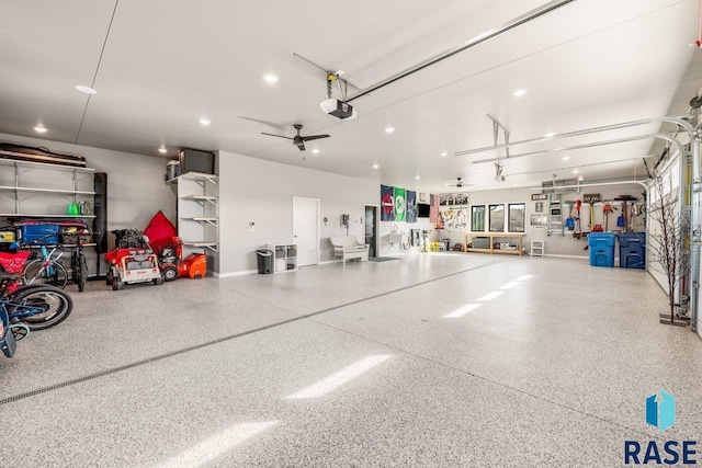 garage featuring recessed lighting and a garage door opener