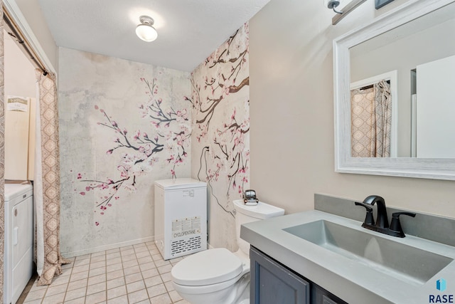 bathroom featuring washer / dryer, tile patterned flooring, toilet, and vanity