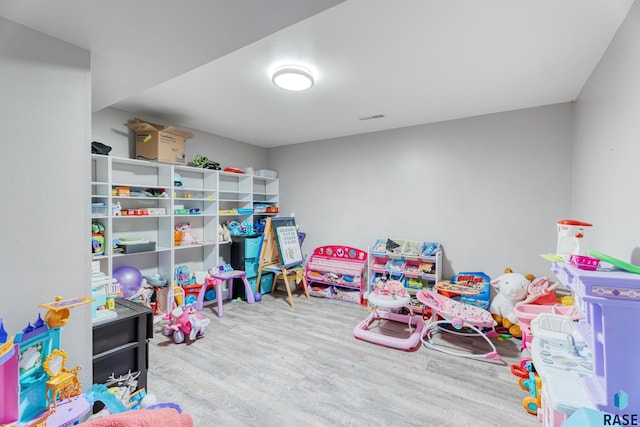 game room with wood finished floors and visible vents
