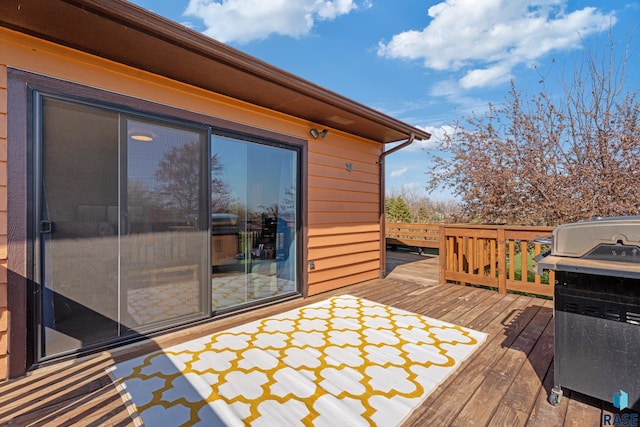 wooden deck with grilling area