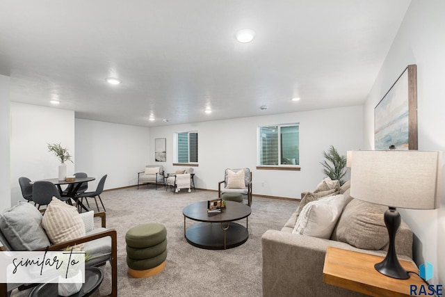 carpeted living room featuring baseboards and recessed lighting
