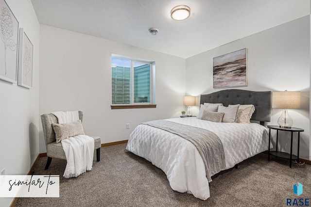 carpeted bedroom featuring baseboards