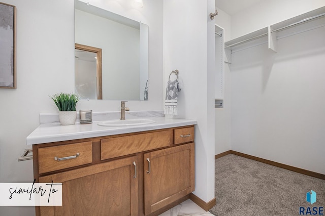 bathroom with baseboards and vanity